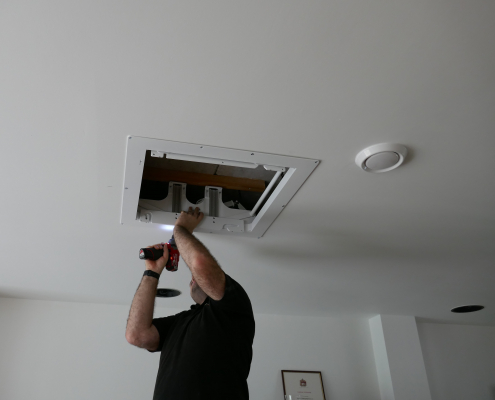 Intelligent home specialists installing TV Projector